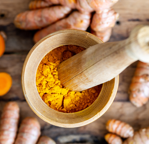 Curcumin powder in mortar and pestle